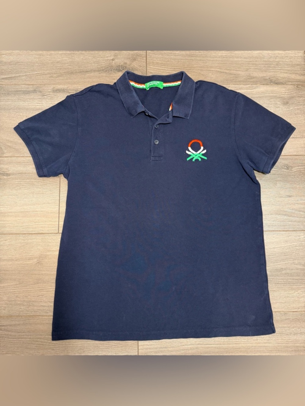 BENETTON Navy Polo Shirt with Orange & Green Logo